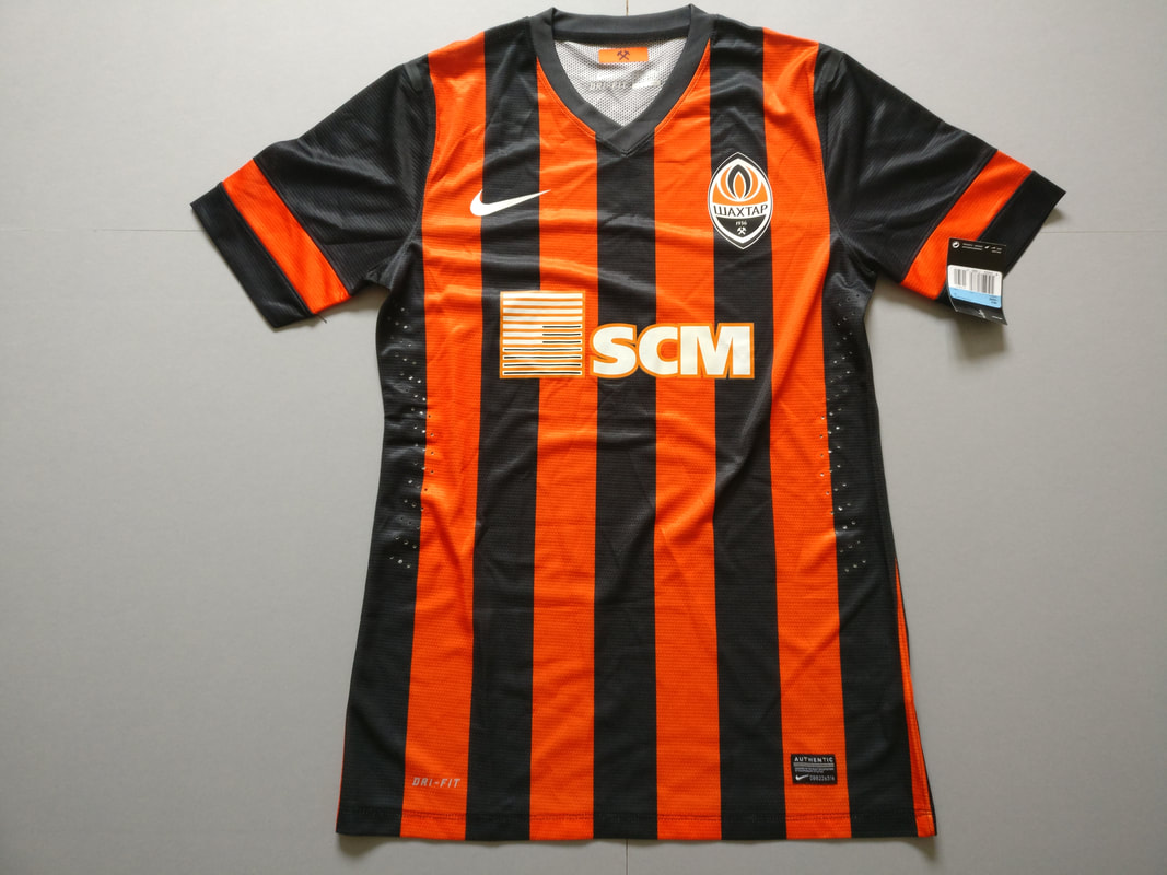 FC Shakhtar Donetsk Home 2013/2015 Football Shirt Manufacrtured By Nike. The Club Plays Football In Ukraine.